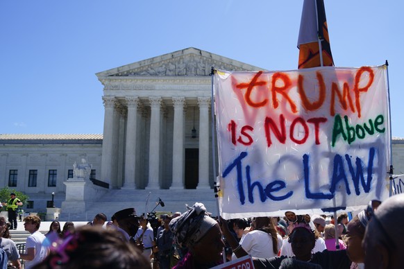 epaselect epa11450280 Protesters gather outside the US Supreme Court, Washington, DC USA, 01 July 2024. The US Supreme Court ruled, on 01 July, that former US President Donald J. Trump is entitled to  ...