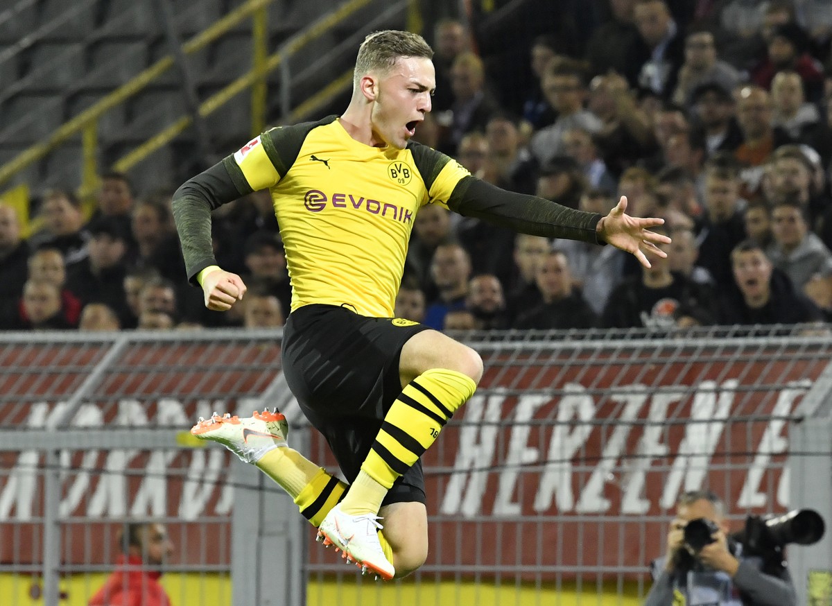Dortmund's Jacob Bruun Larsen celebrates after scoring the opening goal during the German Bundesliga soccer match between Borussia Dortmund and 1.FC Nuremberg in Dortmund, Germany, Wednesday, Sep ...