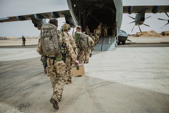 epa10588877 A handout photo made available by the Bundeswehr shows soldiers before departure for the military evacuation operation in Al-Azraq, Jordan, 23 April 2023 (issued 24 April 2023). The German ...