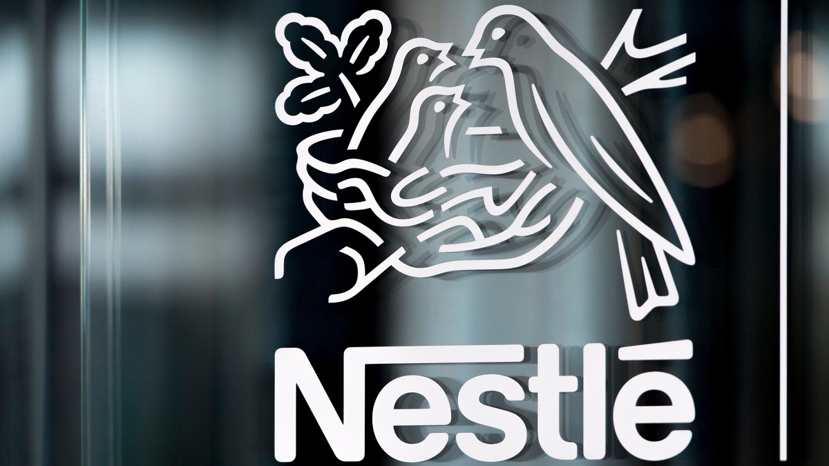 FILE - In this Thursday, Feb. 14, 2019, file photo, Nestle's logo is displayed on a window, during the 2018 full-year results press conference of the food and drinks giant Nestle, in Vevey. (Laur ...
