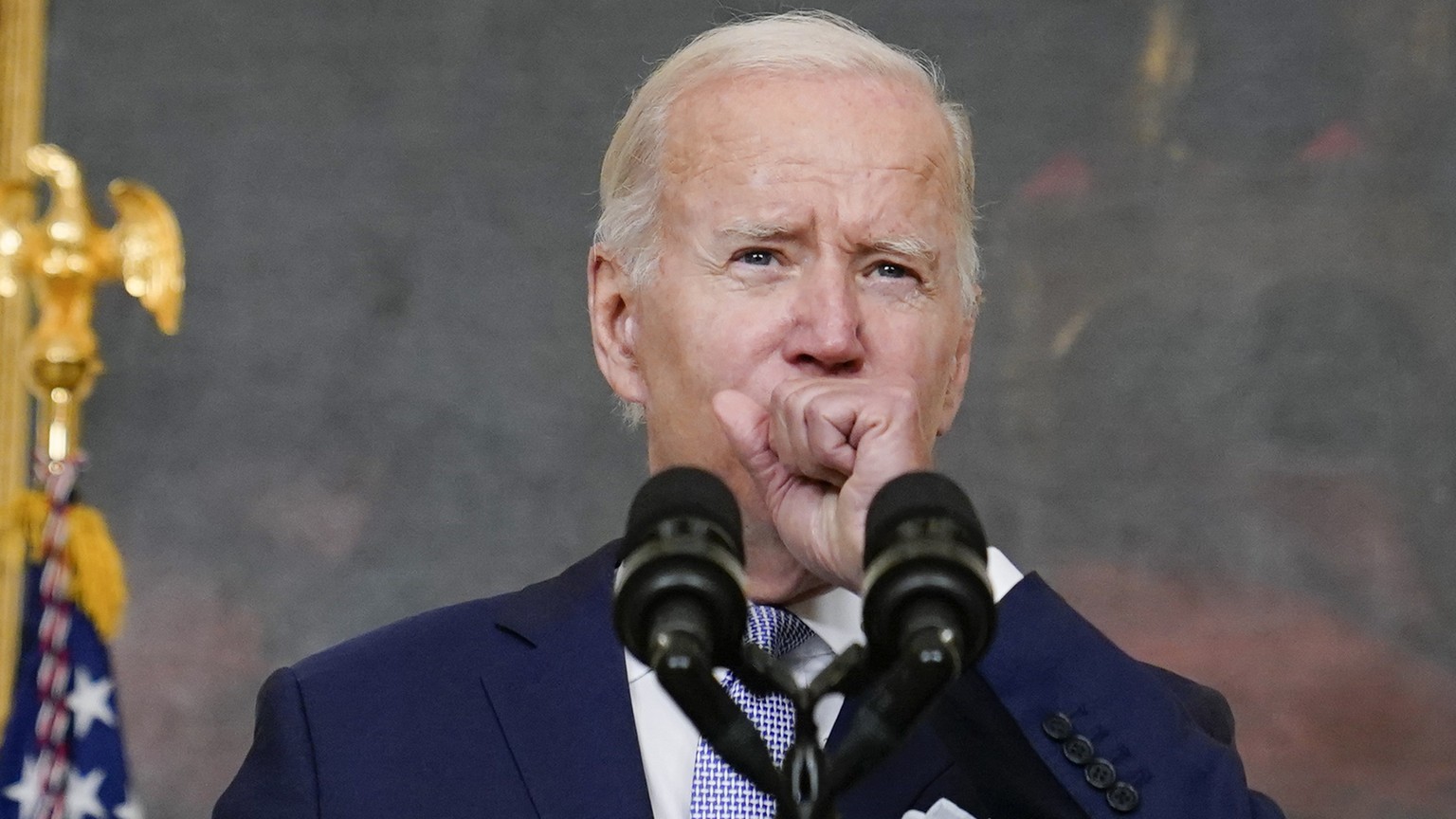 FILE - President Joe Biden coughs as he speaks about &quot;The Inflation Reduction Act of 2022&quot;