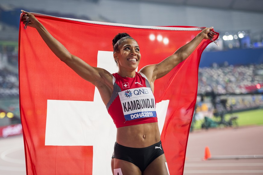 Bronze medal Mujinga Kambundji from Switzerland celebrates during the women&#039;s 200 meters final at the IAAF World Athletics Championships, at the Khalifa International Stadium, in Doha, Qatar, Wed ...