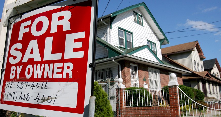 epa08337204 (FILE) - A file photo of a real estate sign in front of a house in Queens, New York on 06 June 2007 (reissued 01 April 2020). Reports on 01 April 2020 state a survey published by the US Mo ...