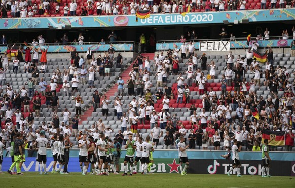 Germany&#039;s players celebrate with fans after the Euro 2020 soccer championship group F match between Portugal and Germany in Munich, Saturday, June 19, 2021. (AP Photo/Matthias Schrader, Pool)