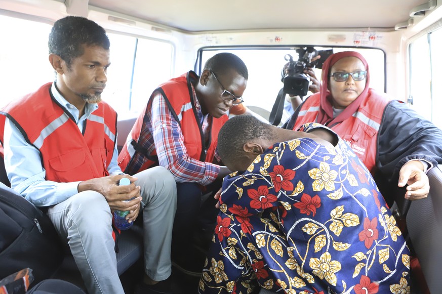 A woman, one of the followers of a Christian sect killed dozens of turns while sitting in a car next to Kenyan Red Cross officials after being rescued by police in a forest in Shakahola, outski…