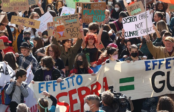 epa09848412 People atttend climate change march of the 'Fridays for Future' movement, in Brescia, Italy, 25 March 2022. EPA/Filippo Venezia