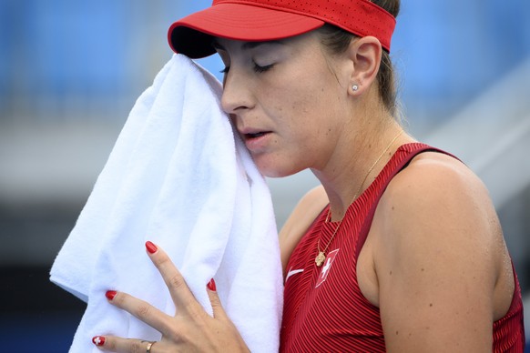 epa09368726 Belinda Bencic of Switzerland reacts after missing a ball against Barbora Krejcikova of Czech Republic during the women&#039;s singles tennis third round match at the 2020 Tokyo Summer Oly ...