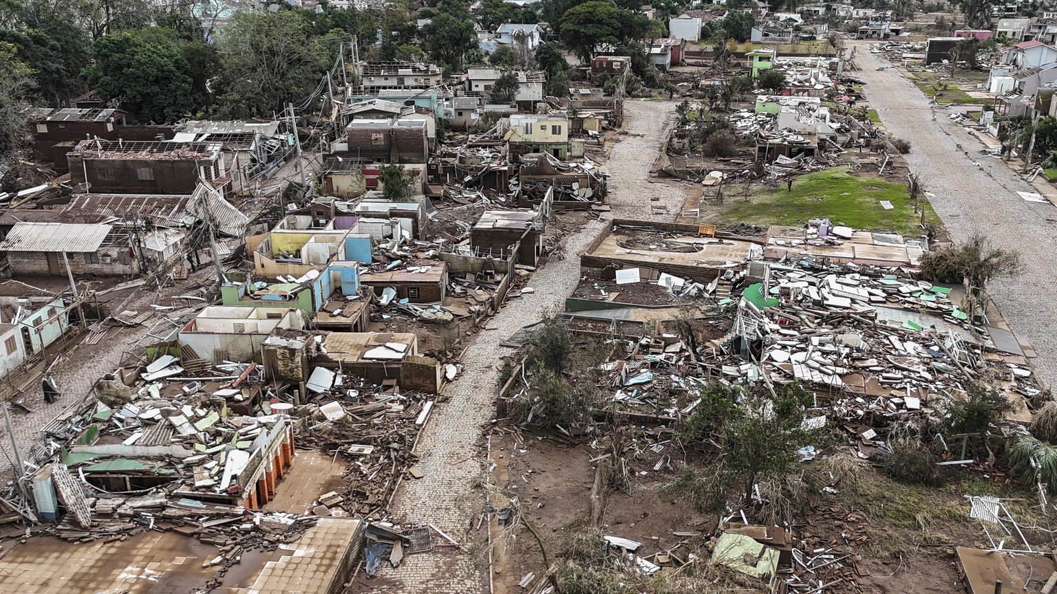 epa11329823 A photo taken with a drone shows the destruction following floods after the overflowing of the Forqueta River in Lajeado, Brasil, 09 May 2024. At least 108 people died and more than 130 we ...
