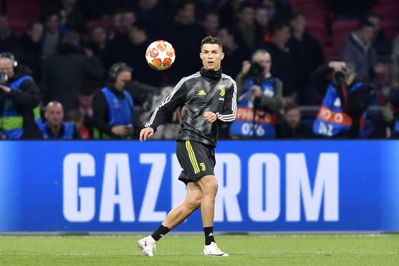 Juventus&#039; Cristiano Ronaldo warms up ahead of the Champions League quarterfinal, first leg, soccer match between Ajax and Juventus at the Johan Cruyff ArenA in Amsterdam, Netherlands, Wednesday,  ...