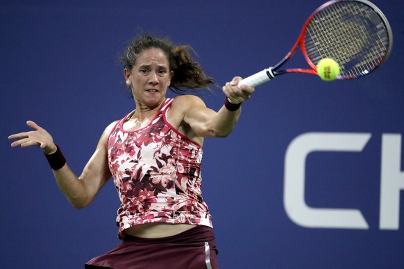 Patty Schnyder, of Switzerland, returns a shot to Maria Sharapova, of Russia, during the first round of the U.S. Open tennis tournament, Tuesday, Aug. 28, 2018, in New York. (AP Photo/Julio Cortez)