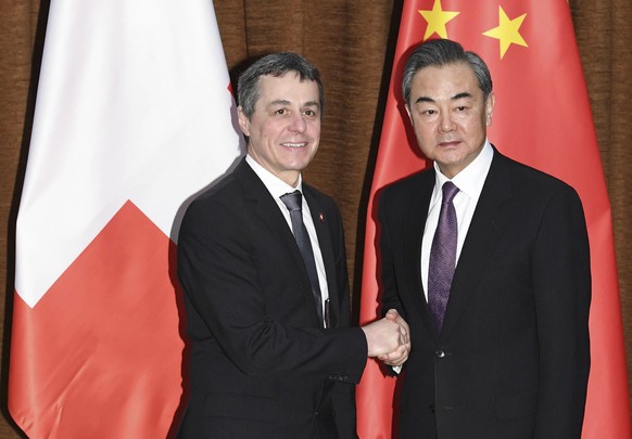 China&#039;s State Councilor and Foreign Minister Wang Yi, right, shakes hands with Swiss Confederation Foreign Minister Ignazio Cassis before their meeting at the Ministry of Foreign Affairs, Tuesday ...