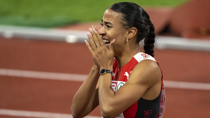 Switzerland&#039;s third-placed Ditaji Kambundji cheers after the Women&#039;s 100 m Hurdles Final at the 2022 European Championships Munich, in the Olympiastadion in Munich, Germany, on Sunday, Augus ...