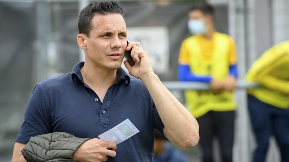 Basel&#039;s director of the board David Degen speaks on his mobile phone during a friendly soccer match as part of the Festival de Football des Alpes between FC Basel 1893 of Switzerland and FC Dynam ...