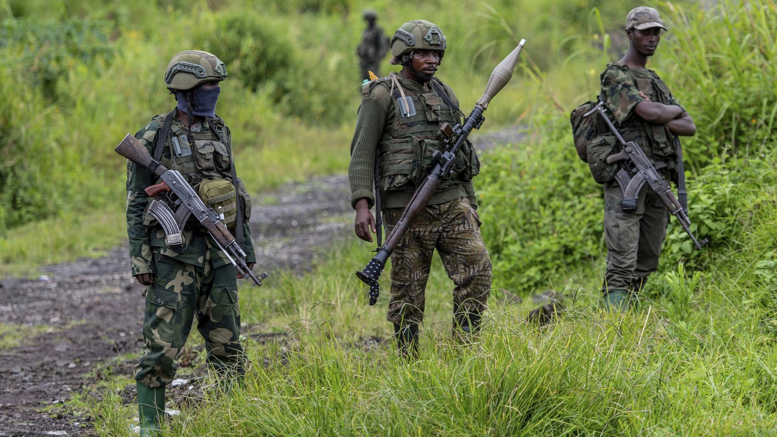FILE - M23 rebels stand with their weapons in Kibumba, in the eastern of Democratic Republic of Congo, Dec. 23, 2022. (AP Photo/Moses Sawasawa, File)
Congo-Rebels-Peace-Agreement