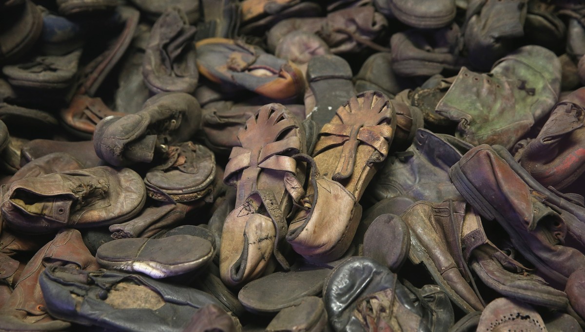 OSWIECIM, POLAND - JANUARY 25: Children's shoes confiscated from Auschwitz prisoners lie in an exhibtion display at the former Auschwitz I concentration camp, which today is a museum, on January  ...