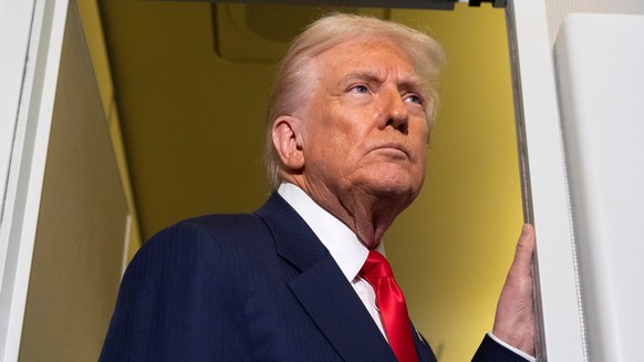 President Donald Trump speaks with reporters aboard Air Force One shortly after taking off from Busan, South Korea, en route to Joint Base Andrews, Md., Thursday, Oct. 30, 2025. (AP Photo/Mark Schiefe ...