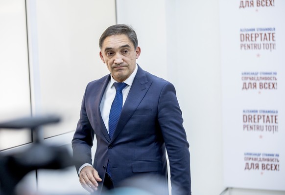 epa11673284 Moldovan presidential candidate and former prosecutor general, Alexandr Stoianoglo, leaves after holding a press conference following the presidential elections and EU membership referendu ...