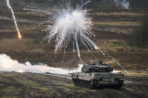 FILE - A Leopard 2 tank is seen in action at the Bundeswehr tank battalion 203 at the Field Marshal Rommel Barracks in Augustdorf, Germany, Wednesday, Feb. 1, 2023. Germany?s defense industry says it  ...