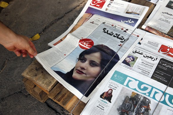 epa10191411 Iranian daily newspapers reporting Mahsa Amini���s death, in Tehran, Iran, 18 September 2022. Mahsa Amini, a 22 year old girl, was detained on 13 September by the police unit responsible f ...