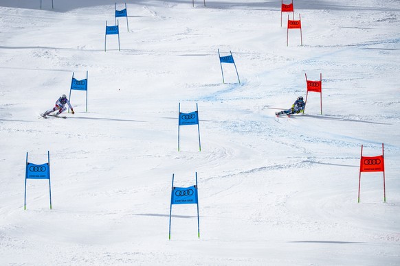 Wendy Holdener of Switzerland, left, in action against Paula Moltzan of the United States, right, during the 1/4 final of the women&#039;s Parallel race at the 2021 FIS Alpine Skiing World Championshi ...