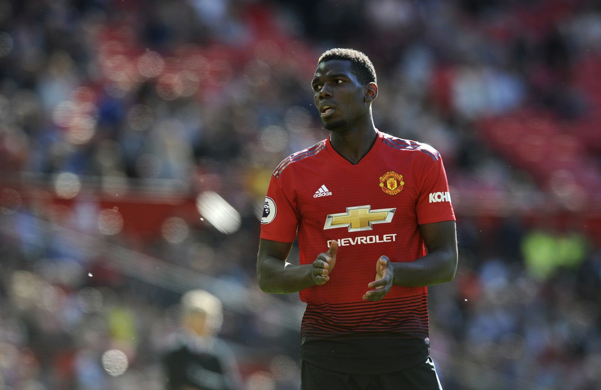 Manchester United's Paul Pogba applauds during the English Premier League soccer match between Manchester United and Cardiff City at Old Trafford in Manchester, England, Sunday, May 12, 2019. (AP ...