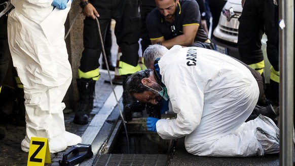 epa07741616 Carabinieri officer and forensic police work a crime scene where Vice Brigadier of Carabinieri Mario Cerciello Rega was shoot dead by robbers last night in via Pietro Cossa, Rome, Italy, 2 ...