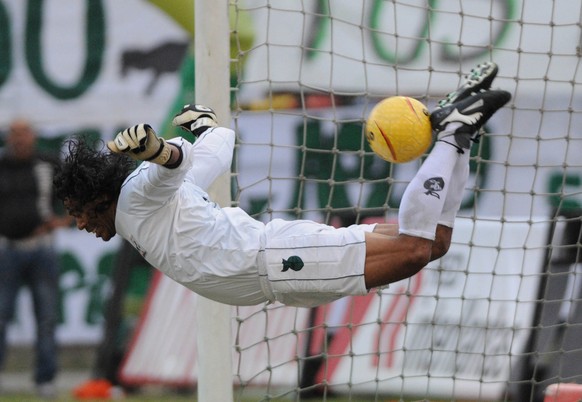 Goalkeeper Rene Higuita kicks the ball during his farewell match between a team of Colombia all-stars and top players from the 1990s of the Colombian club Atletico Nacional in Medellin, Colombia, Sund ...