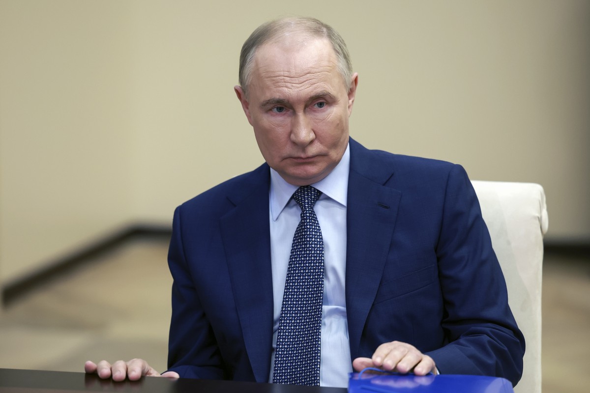 Russian President Vladimir Putin listens to Moscow-appointed head of Russian-controlled Zaporizhzhia region of Ukraine Yevgeny Balitsky during their meeting at the Novo-Ogaryovo residence outside Mosc ...