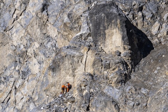epa11722545 Emergency officials set up equipment on the &#039;Brienzer Rutsch&#039; rockfall danger zone near the village of Brienz-Brinzauls, Switzerland, 15 November 2024. A flow of debris nearly re ...