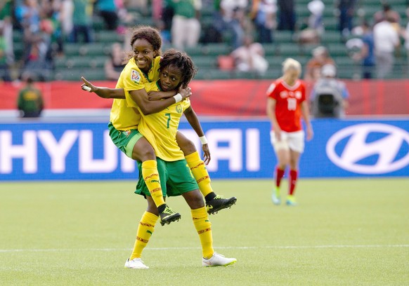 Cameroon&#039;s Gabrielle Onguene (7) and Jeannette Yango (10) celebrate a goal against Switzerland during the first half of a FIFA Women&#039;s World Cup soccer match, Tuesday, June 16, 2015 in Edmon ...