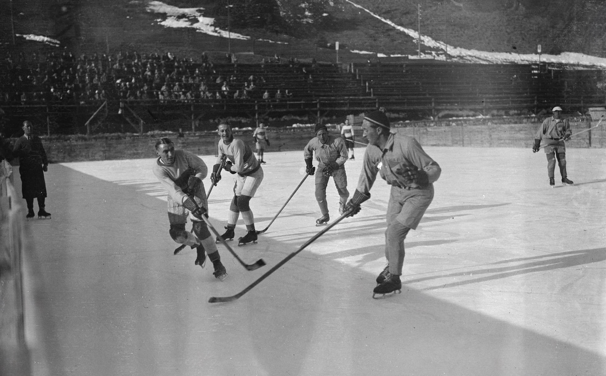 Switzerland English hockey team in action at St Moritz . The Sussex hockey club met the St Moritz club in a match on the ice at the famous Switzerland sports resort . A scene during the game between t ...