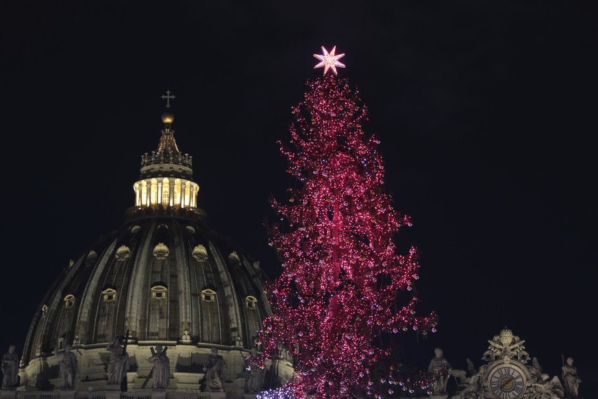 A nativity scene and a 29-meter-tall Christmas tree are lit in St. Peter&#039;s Square at The Vatican, Saturday, Dec. 7, 2024. (AP Photo/Andrew Medichini)