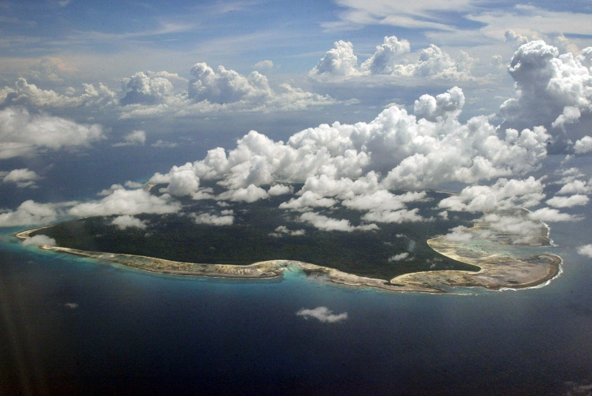FILE – In this Nov. 14, 2005 file photo, clouds hang over the North Sentinel Island, in India's southeastern Andaman and Nicobar Islands. An American is believed to have been killed by an isolate ...