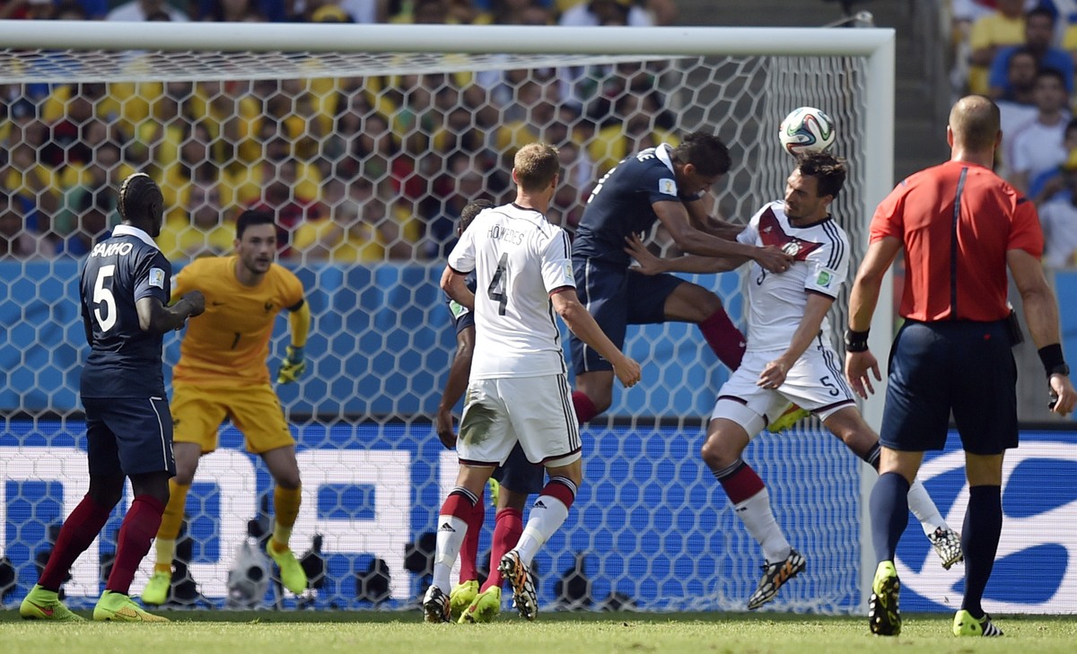 Germany's Mats Hummels, second right, scores the opening goal during the World Cup quarterfinal soccer match between Germany and France at the Maracana Stadium in Rio de Janeiro, Brazil, Friday,  ...