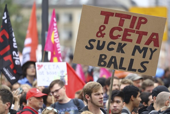 Consumer rights activists take part in a march to protest against the Transatlantic Trade and Investment Partnership (TTIP) and Comprehensive Economic and Trade Agreement (CETA) in Frankfurt, Germany, ...