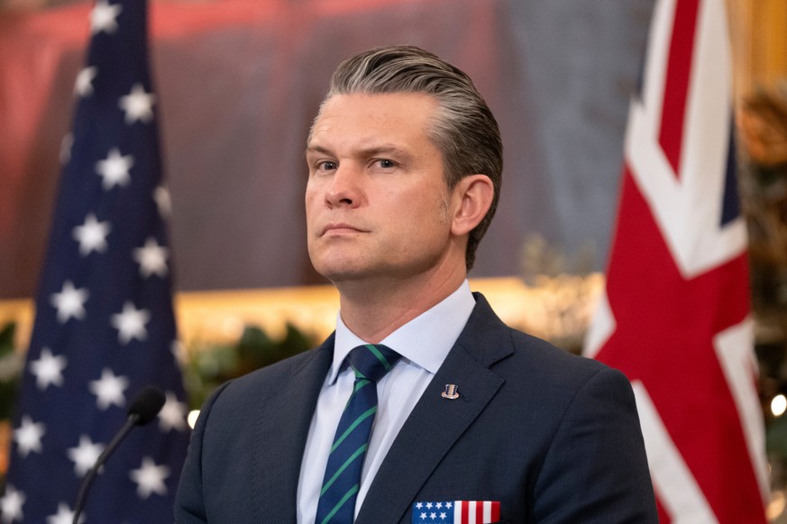 Defense Secretary Pete Hegseth listens during an event at the State Department, Monday, Dec. 8, 2025, in Washington. (AP Photo/Mark Schiefelbein)
Pete Hegseth