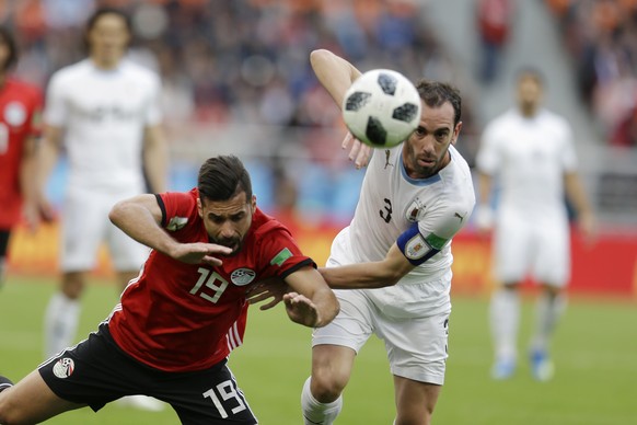 Uruguay&#039;s Diego Godin, right, challenges for the ball with Egypt&#039;s Abdalla Said during the group A match between Egypt and Uruguay at the 2018 soccer World Cup in the Yekaterinburg Arena in  ...