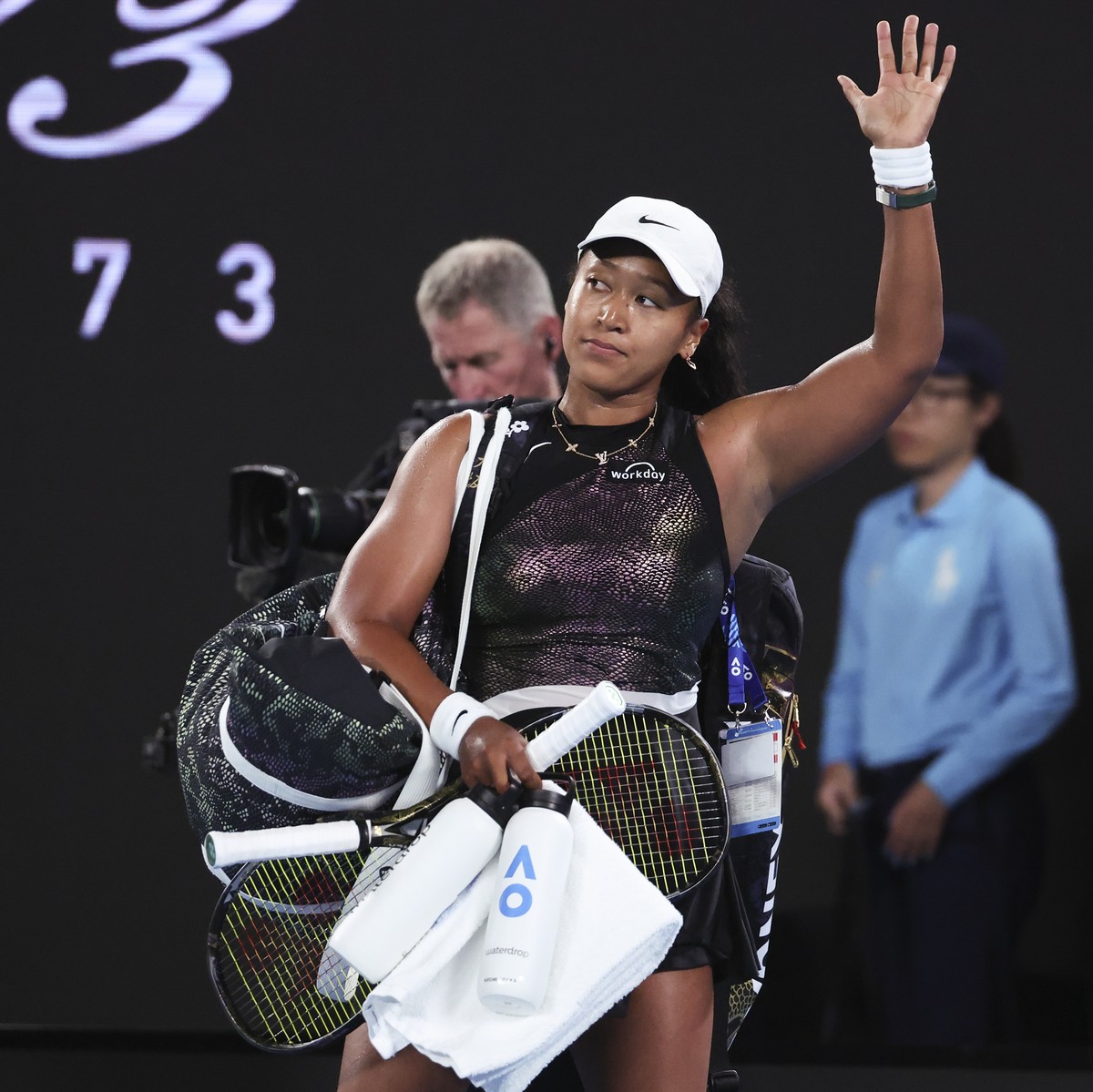 Naomi Osaka of Japan waves as she leaves Rod Laver Arena following her first round loss to Caroline Garcia of France at the Australian Open tennis championships at Melbourne Park, Melbourne, Australia ...