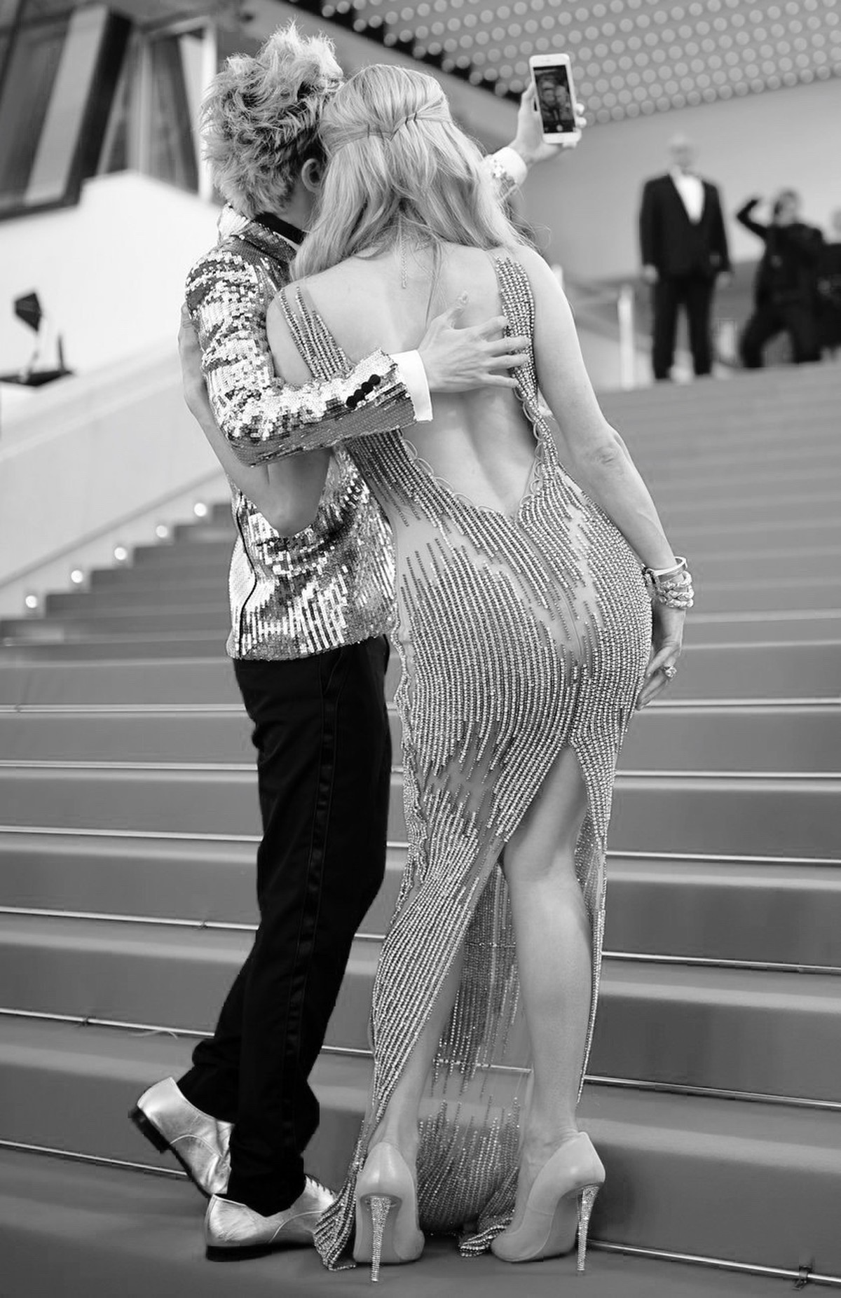 epa04755693 US socialite Paris Hilton (R) and Chinese actor Sun Zu Yang (L) make a selfie as they arrive for the screening of 'Inside Out' during the 68th annual Cannes Film Festival, in Can ...