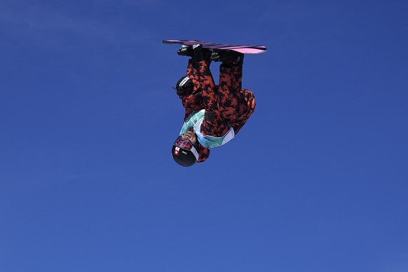 Nicolas Huber of Switzerland competes during the men&#039;s snowboard big air qualifications of the 2022 Winter Olympics, Monday, Feb. 14, 2022, in Beijing. (AP Photo/Jae C. Hong)