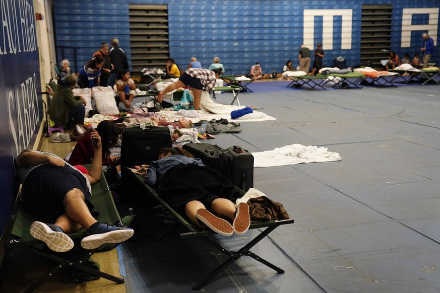 August 9, 2023, Kahului, Hawaii, USA: Residents and tourists seek shelter at Maui High School, in Kahului. A large fire consumed the town of Lahaina. At least six people have died in fires in Maui, of ...
