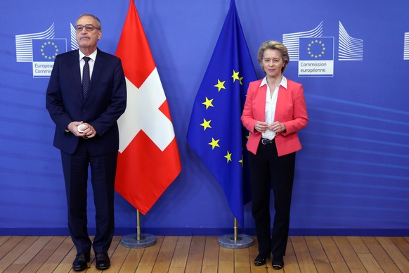 epa09154268 European Commission President Ursula Von der Leyen (R) and Swiss President Guy Parmelin pose prior to a meeting at the European Commission building in Brussels, Belgium, 23 April 2021. EPA ...