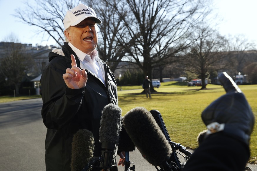 President Donald Trump gestures as a reporter asks a question, as he speaks to the media on the South Lawn of the White House, Thursday Jan. 10, 2019, in Washington, en route for a trip to the border  ...