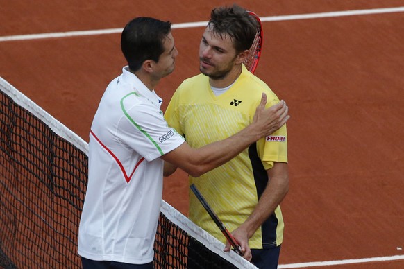 Switzerland&#039;s Stanislas Wawrinka greets Spain&#039;s Guillermo Garcia-Lopez, left, after losing the first round match of the French Open tennis tournament in four sets at the Roland Garros stadiu ...