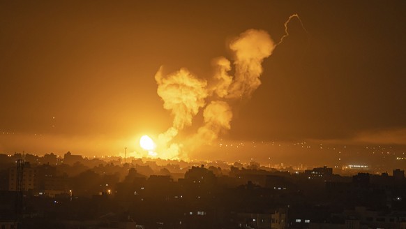 Fire and smoke rise following an Israeli airstrike in central Gaza Strip, Friday, April 7, 2023. The Israeli military has struck targets in the Gaza Strip, pushing the region toward a wider conflagrat ...