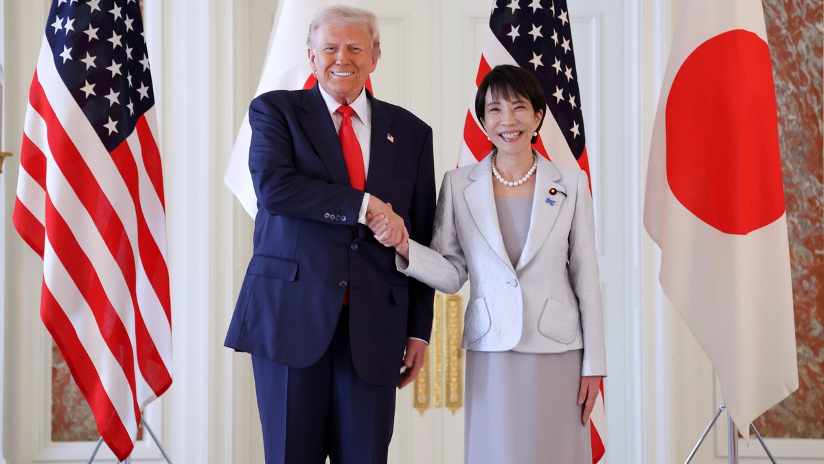 epa12487126 US President Donald Trump (L) shakes hands with Japan's Prime Minister Sanae Takaichi upon his arrival at Akasaka Palace State Guest House for the Japan-US summit meeting in Tokyo, Ja ...