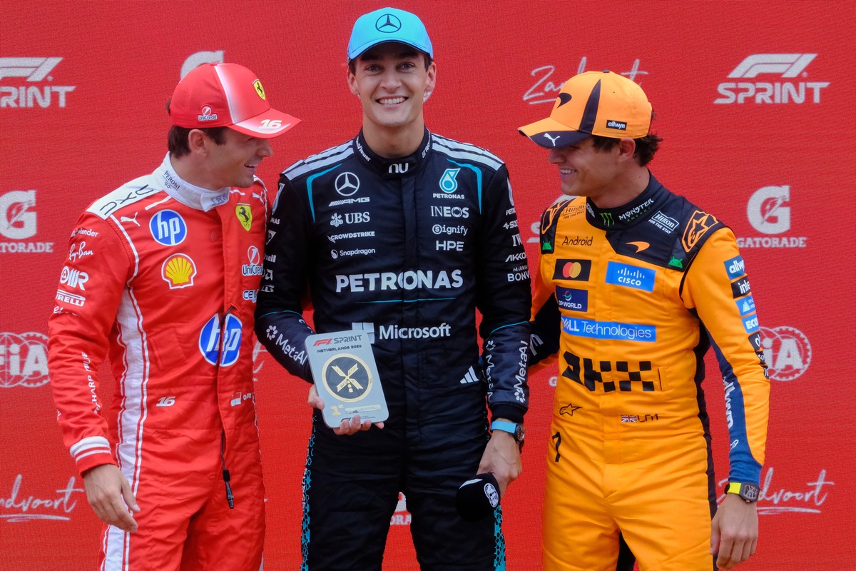 Froma the left, second-placed Ferrari driver Charles Leclerc of Monaco, first-placed Mercedes driver George Russell of Britain and third placed McLaren driver Lando Norris of Britain stand on the podi ...