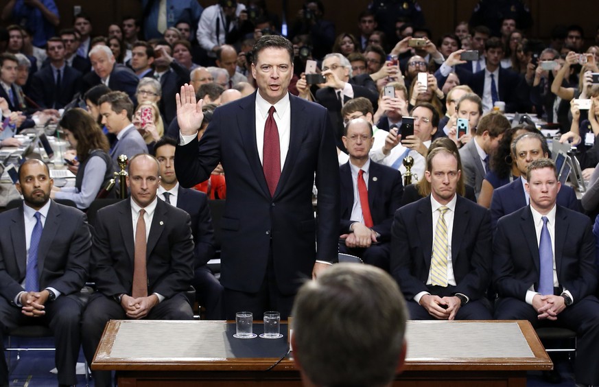 Former FBI Director James Comey is sworn in during a Senate Intelligence Committee hearing on Capitol Hill, Thursday, June 8, 2017, in Washington. (AP Photo/Alex Brandon, Pool)