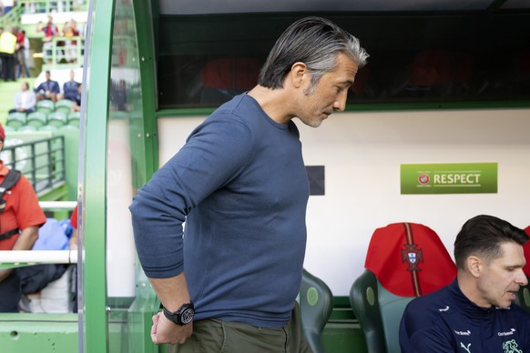 Switzerland&#039;s head coach Murat Yakin, left, gestures past Switzerland&#039;s assistant coach Vincent Cavin, right, during the UEFA Nations League group A2 soccer match between Portugal and Switze ...