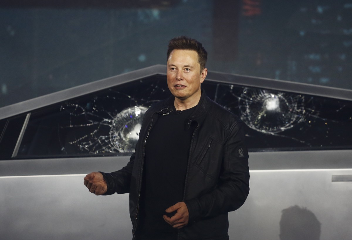 Tesla CEO Elon Musk introduces the Cybertruck at Tesla's design studio Thursday, Nov. 21, 2019, in Hawthorne, Calif. Musk is taking on the workhorse heavy pickup truck market with his latest elec ...